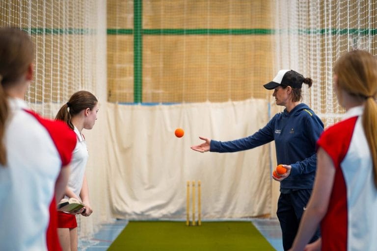 People Playing indoor Cricket