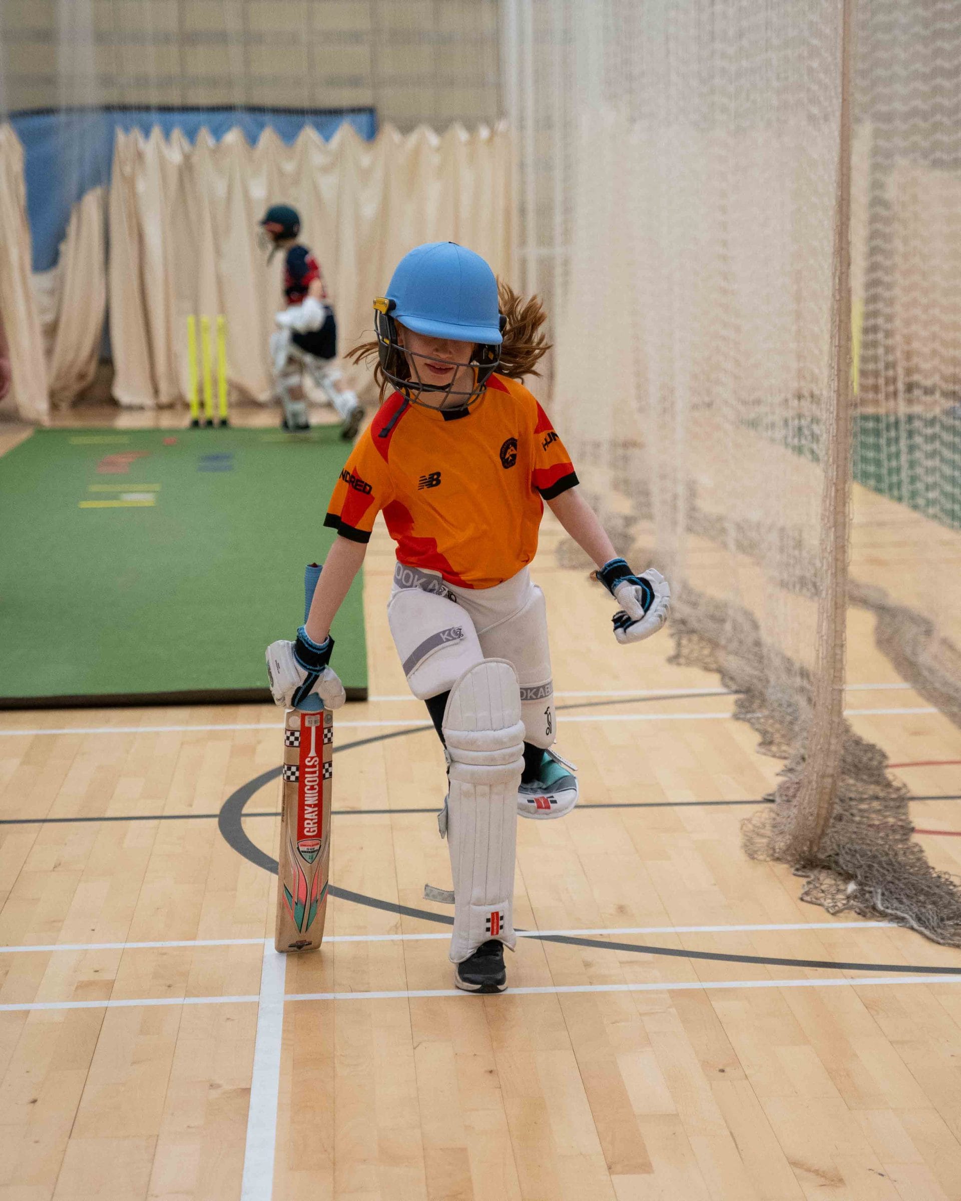 A Child Playing Cricket